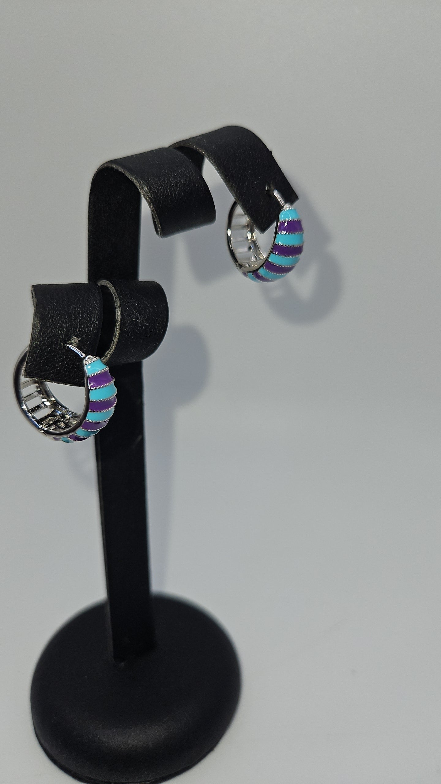 Earing blue and purple